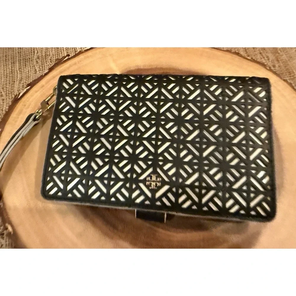 Tory Burch Fret-T wallet Wrislet on a Black & White Lace Cut Out Zip Around